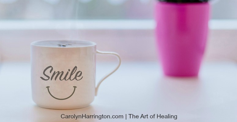 A mug with the word smile on it